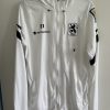 Einlaufjacke 2021/22. Vom Team getragen. Fabian Greilinger, #11, Größe M.